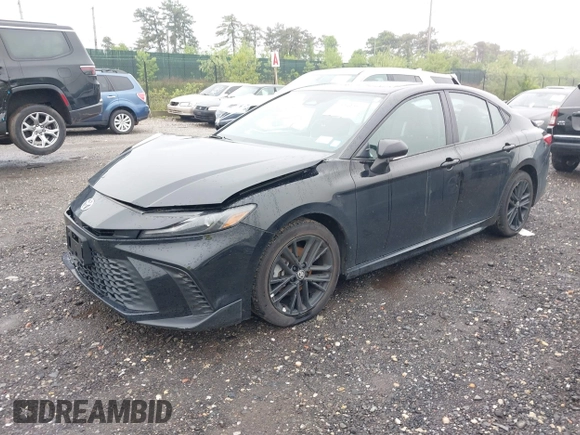 2025 Toyota Camry LE z VIN 4T1DBADK7SU513802, wystawiony jako IAAI lot #42259217 z przebiegiem 27 379 mil mil oraz . Historia ofert i sprzedaży dostępna na DreamBid. Obrazek 20.