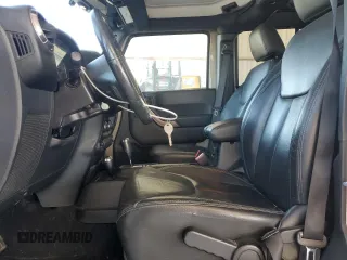 2018 Jeep Wrangler JK Unlimited Sahara with VIN 1C4BJWEGXJL889159, listed as a Copart auction lot 76523774 with 77,528 mi miles and Salvage Title. Bid and sale history available at carsss.com. Image 7.
