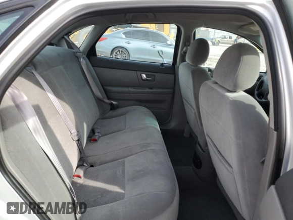 2003 Ford Taurus LX Standard z VIN 1FAFP52U93A159333, wystawiony jako Copart lot #78080944 z przebiegiem 54 652 mil mil oraz Szkoda całkowita • Salvage title. Historia ofert i sprzedaży dostępna na DreamBid. Obrazek 10.