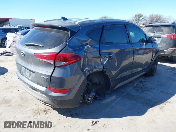 2018 Hyundai Tucson Sport with VIN KM8J33AL5JU770092, listed as a IAAI auction lot 41395349 with 101,395 mi miles. Bid and sale history available at carsss.com. Image 4.