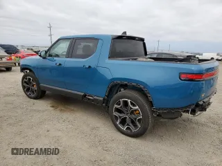 2023 Rivian R1T Launch Edition with VIN 7FCTGAAL7PN019188, listed as a Copart auction lot 55100405 with 13,654 mi miles and Salvage Title. Bid and sale history available at DreamBid. Image 2.