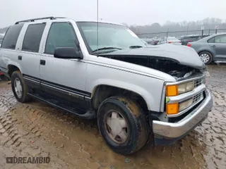 1997 Chevrolet Tahoe with VIN 1GNEK13R0VJ351919, listed as a IAAI auction lot 41028840 with 218,937 mi miles. Bid and sale history available at carsss.com. Image 1.