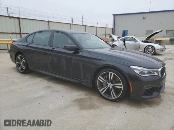 2018 BMW 7 Series ALPINA B7 xDrive with VIN WBA7F2C5XJG423853, listed as a Copart auction lot 88920175 with 124,652 mi miles and Salvage Title. Bid and sale history available at carsss.com. Image 4.