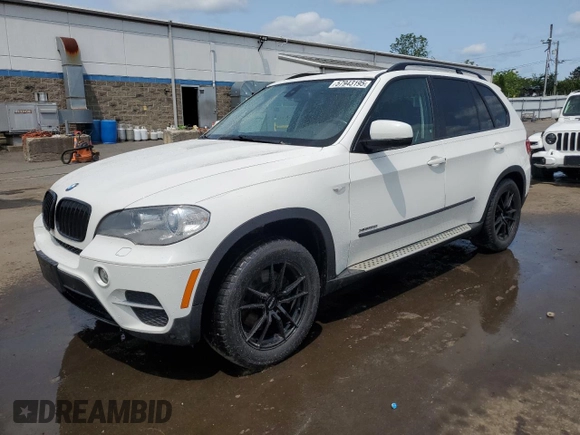 2012 BMW X5 35i with VIN 5UXZV4C54CL763857, listed as a Copart auction lot 57943195 with 143,522 mi miles and Salvage title. Bid and sale history available at DreamBid. Image 1.