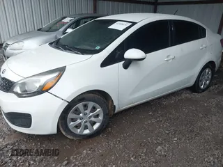2014 Kia Rio LX with VIN KNADM4A35E6350778, listed as a IAAI auction lot 42188131 with 162,754 mi miles and . Bid and sale history available at DreamBid. Image 2.