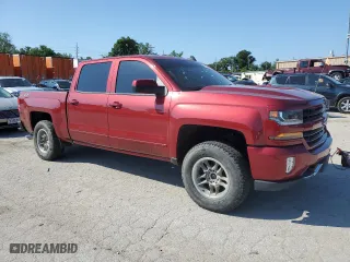 2018 Chevrolet Silverado 1500 LT with VIN 3GCUKREC5JG203272, listed as a Copart auction lot 61239994 with 82,485 mi miles and Salvage Title. Bid and sale history available at carsss.com. Image 4.