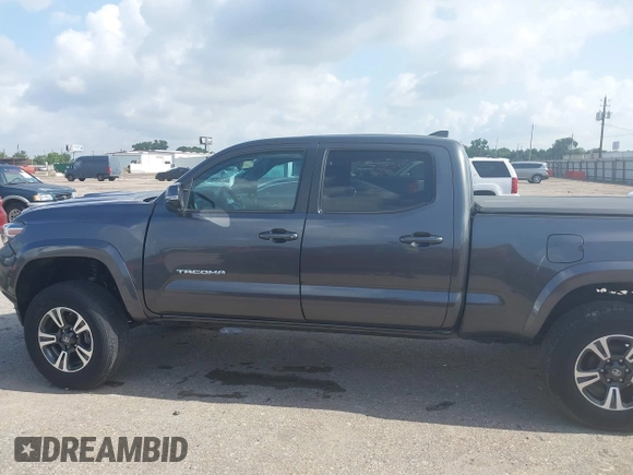 2018 Toyota Tacoma SR5 with VIN 3TMDZ5BN0JM051283, listed as a IAAI auction lot 42438690 with 106,155 mi miles and . Bid and sale history available at DreamBid. Image 14.