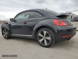 2012 Volkswagen Beetle 2.0T Turbo w/Sun/Sound with VIN 3VWV67AT2CM664806, listed as a Copart auction lot 86595164 with 158,239 mi miles and Salvage Title. Bid and sale history available at carsss.com. Image 2.