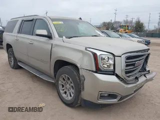 2015 GMC Yukon XL SLE z VIN 1GKS1GKC1FR155056, wystawiony jako IAAI lot #41517607 z przebiegiem 174 634 mil mil oraz . Historia ofert i sprzedaży dostępna na DreamBid. Obrazek 1.
