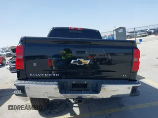 2014 Chevrolet Silverado 1500 LT with VIN 3GCUKREH8EG210945, listed as a IAAI auction lot 41718435 with 106,320 mi miles and . Bid and sale history available at DreamBid. Image 16.