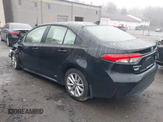 2023 Toyota Corolla Hybrid LE with VIN JTDBDMHE1P3001381, listed as a IAAI auction lot 41898054 with 76,971 mi miles. Bid and sale history available at carsss.com. Image 3.