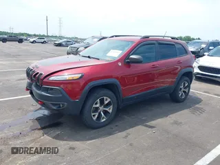 2014 Jeep Cherokee Trailhawk with VIN 1C4PJMBS7EW162357, listed as a IAAI auction lot 42601903 with 104,768 mi miles and . Bid and sale history available at DreamBid. Image 2.