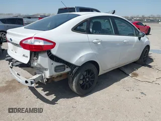 2016 Ford Fiesta SE with VIN 3FADP4BJ7GM175966, listed as a IAAI auction lot 41821964 with 100,375 mi miles. Bid and sale history available at carsss.com. Image 4.