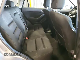 2014 Mazda CX-5 Touring z VIN JM3KE4CY5E0393463, wystawiony jako Copart lot #57776665 z przebiegiem 91 565 mil mil oraz Szkoda całkowita • Salvage title. Historia ofert i sprzedaży dostępna na DreamBid. Obrazek 10.