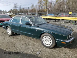1998 Jaguar XJ with VIN SAJHX1241WC839104, listed as a Copart auction lot 81911744 with 61,956 mi miles and Clean title. Bid and sale history available at DreamBid. Image 4.
