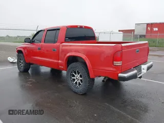 2001 Dodge Dakota Sport z VIN 1B7GG2AN91S110843, wystawiony jako IAAI lot #42316636 z przebiegiem 263 073 mil mil oraz . Historia ofert i sprzedaży dostępna na DreamBid. Obrazek 3.