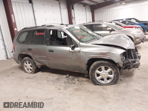 2005 GMC Envoy SLT with VIN 1GKDT13S352257892, listed as a IAAI auction lot 41690880 with 134,216 mi miles. Bid and sale history available at carsss.com. Image 13.