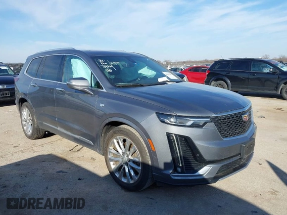 2020 Cadillac XT6 FWD Premium Luxury z VIN 1GYKPCRS8LZ129799, wystawiony jako IAAI lot #41602536 z przebiegiem 96 865 mil mil oraz . Historia ofert i sprzedaży dostępna na DreamBid. Obrazek 1.