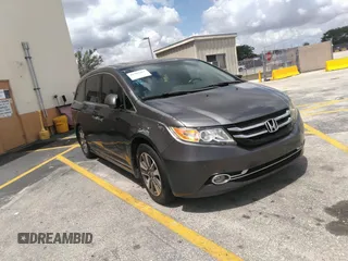 2014 Honda Odyssey Touring with VIN 5FNRL5H95EB053140, listed as a IAAI auction lot 41902167 with 142,710 mi miles and . Bid and sale history available at carsss.com. Image 1.