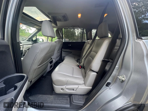 2018 Honda Pilot Touring z VIN 5FNYF6H94JB070661, wystawiony jako Copart lot #60926415 z przebiegiem 205 538 mil mil oraz Czysty tytuł • Clean title. Historia ofert i sprzedaży dostępna na DreamBid. Obrazek 11.