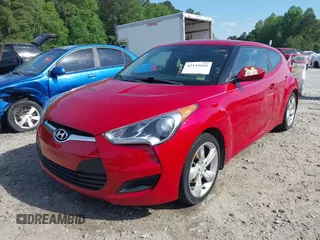 2013 Hyundai Veloster w/Gray Int with VIN KMHTC6AD8DU112810, listed as a IAAI auction lot 42144625 with 142,524 mi miles and . Bid and sale history available at DreamBid. Image 2.