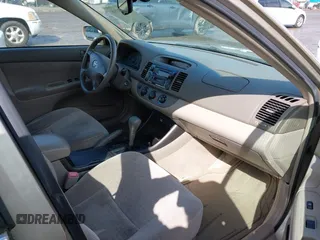 2004 Toyota Camry LE with VIN JTDBE32K440272373, listed as a IAAI auction lot 41949768 with 205,093 mi miles. Bid and sale history available at carsss.com. Image 5.
