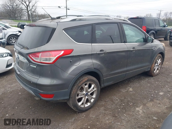 2014 Ford Escape Titanium with VIN 1FMCU0JX2EUA28679, listed as a IAAI auction lot 41930585 with 164,038 mi miles. Bid and sale history available at carsss.com. Image 4.