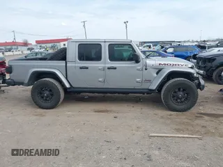 2021 Jeep Gladiator Mojave with VIN 1C6JJTEG9ML519309, listed as a IAAI auction lot 41701544 with 64,461 mi miles and . Bid and sale history available at DreamBid. Image 13.