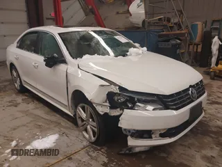 2014 Volkswagen Passat TDI SEL Premium with VIN 1VWCN7A30EC046107, listed as a IAAI auction lot 41573427 with 129,856 mi miles. Bid and sale history available at carsss.com. Image 1.