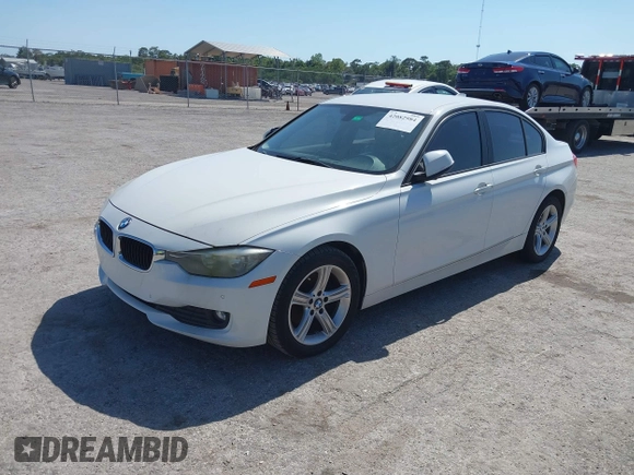 2014 BMW 3 Series 320i with VIN WBA3B1G53ENT00444, listed as a IAAI auction lot 42082984 with 94,401 mi miles. Bid and sale history available at carsss.com. Image 2.