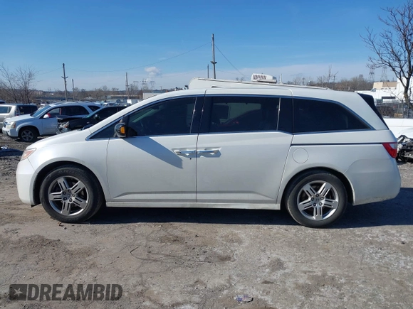 2012 Honda Odyssey Touring with VIN 5FNRL5H96CB010696, listed as a IAAI auction lot 41605868 with 109,411 mi miles and . Bid and sale history available at carsss.com. Image 14.