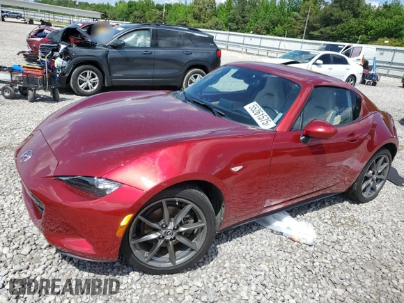 2020 Mazda MX-5 Miata Grand Touring z VIN JM1NDAM70L0414102, wystawiony jako Copart lot #55261575 z przebiegiem 70 157 mil mil oraz Szkoda całkowita • Salvage title. Historia ofert i sprzedaży dostępna na DreamBid. Obrazek 1.