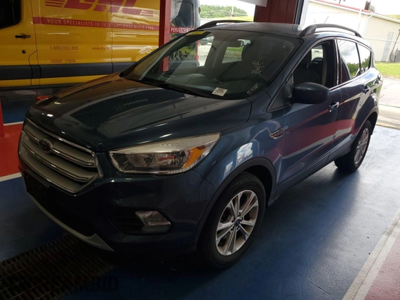 2018 Ford Escape SE z VIN 1FMCU9GD2JUA75853, wystawiony jako IAAI lot #42399997 z przebiegiem 89 772 mil mil oraz . Historia ofert i sprzedaży dostępna na DreamBid. Obrazek 4.