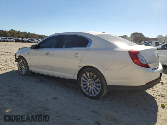 2013 Lincoln MKS z VIN 1LNHL9DK0DG605400, wystawiony jako Copart lot #77071034 z przebiegiem 73 450 mil mil oraz Szkoda całkowita • Salvage title. Historia ofert i sprzedaży dostępna na DreamBid. Obrazek 2.