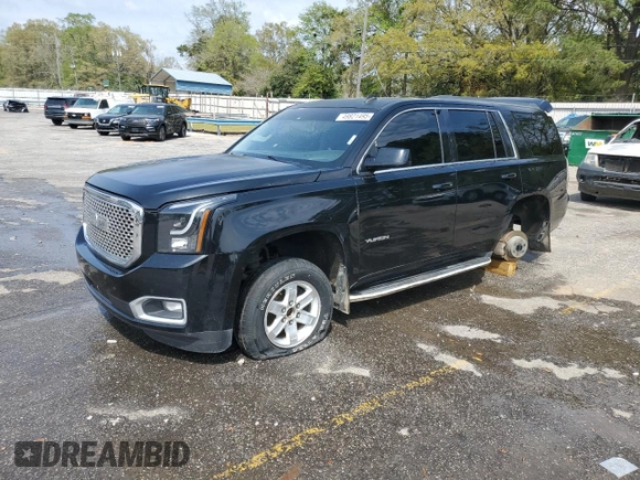 2015 GMC Yukon SLT with VIN 1GKS1BKC0FR113013, listed as a Copart auction lot 49821495 with 294,596 mi miles and Salvage Title. Bid and sale history available at carsss.com. Image 1.