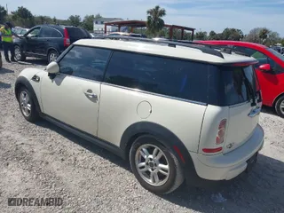 2013 MINI Cooper Clubman with VIN WMWZF3C57DT571338, listed as a IAAI auction lot 41367674 with 77,628 mi miles. Bid and sale history available at carsss.com. Image 3.