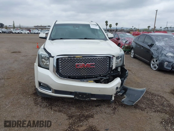 2015 GMC Yukon XL Denali with VIN 1GKS2JKJ7FR641430, listed as a IAAI auction lot 42163969 with 129,085 mi miles. Bid and sale history available at carsss.com. Image 12.