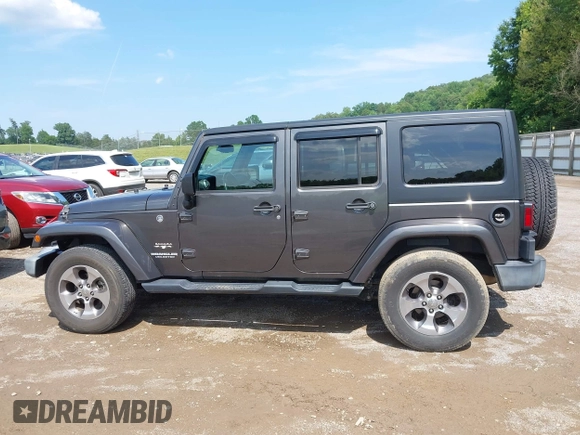 2016 Jeep Wrangler Unlimited Sahara with VIN 1C4BJWEG7GL340074, listed as a IAAI auction lot 42434763 with 81,095 mi miles and . Bid and sale history available at DreamBid. Image 14.