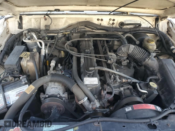 1999 Jeep Cherokee Sport with VIN 1J4FT68S6XL578679, listed as a Copart auction lot 76697394 with 196,110 mi miles and Salvage title. Bid and sale history available at DreamBid. Image 12.