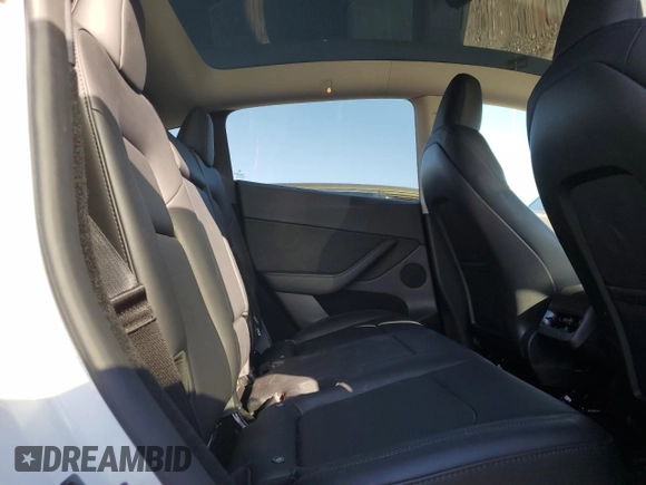 2024 Tesla Model Y with VIN 7SAYGDED9RF094494, listed as a Copart auction lot 50298115 with 7,858 mi miles and Salvage Title. Bid and sale history available at DreamBid. Image 10.