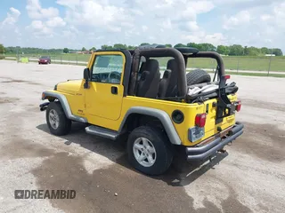 2004 Jeep Wrangler Sport z VIN 1J4FA49S04P701986, wystawiony jako IAAI lot #42256648 z przebiegiem 129 946 mil mil oraz . Historia ofert i sprzedaży dostępna na DreamBid. Obrazek 3.