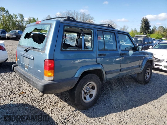 1999 Jeep Cherokee Sport with VIN 1J4FT68S1XL577603, listed as a Copart auction lot 54216115 with 180,128 mi miles and Salvage title. Bid and sale history available at DreamBid. Image 3.