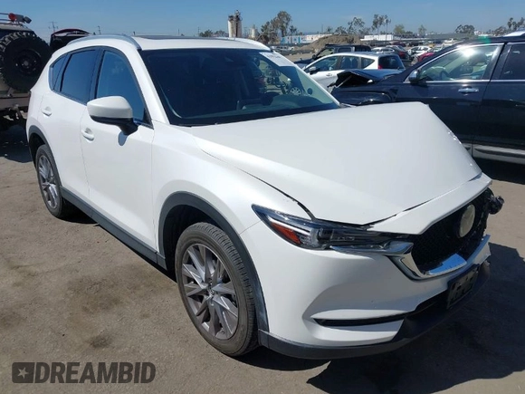2020 Mazda CX-5 Grand Touring with VIN JM3KFADM0L1838495, listed as a IAAI auction lot 41991566 with 32,021 mi miles. Bid and sale history available at carsss.com. Image 1.