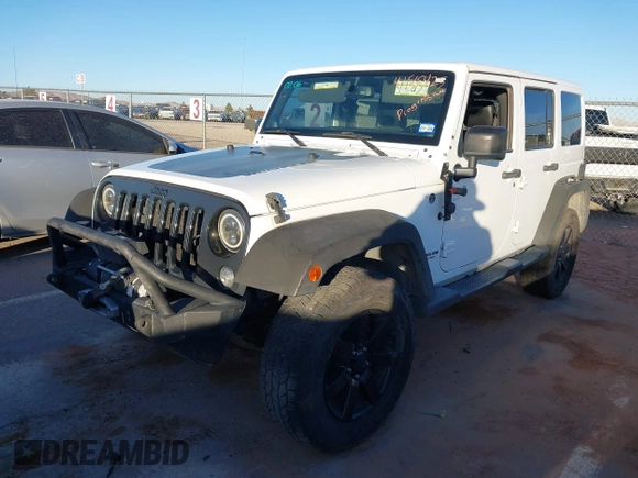 2014 Jeep Wrangler Unlimited Sahara with VIN 1C4BJWEG0EL273475, listed as a IAAI auction lot 41515425 with 128,900 mi miles. Bid and sale history available at carsss.com. Image 17.