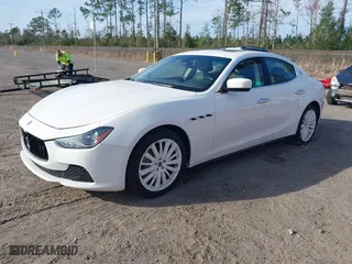 2015 Maserati Ghibli with VIN ZAM57XSA6F1156252, listed as a IAAI auction lot 41530186 with 84,417 mi miles. Bid and sale history available at carsss.com. Image 2.