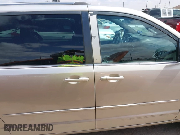 2014 Dodge Grand Caravan SXT with VIN 2C4RDGCG6ER466459, listed as a IAAI auction lot 41820907 with 105,404 mi miles and . Bid and sale history available at DreamBid. Image 12.
