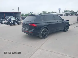 2023 Volkswagen Tiguan SE R-Line Black with VIN 3VVCB7AX1PM106543, listed as a IAAI auction lot 41784559 with 39,846 mi miles and . Bid and sale history available at DreamBid. Image 4.