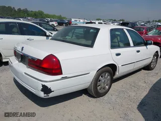 2003 Mercury Grand Marquis LS Premium with VIN 2MEFM75W33X669341, listed as a IAAI auction lot 42063018 with 124,047 mi miles. Bid and sale history available at carsss.com. Image 4.