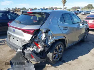 2021 Lexus UX 250h F Sport with VIN JTHE9JBH8M2051954, listed as a IAAI auction lot 40978984 with 60,276 mi miles and . Bid and sale history available at DreamBid. Image 4.
