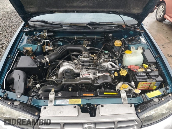 1996 Subaru Legacy Outback with VIN 4S3BG685XT7984194, listed as a Copart auction lot 77999224 with 130,804 mi miles and Salvage title. Bid and sale history available at DreamBid. Image 12.